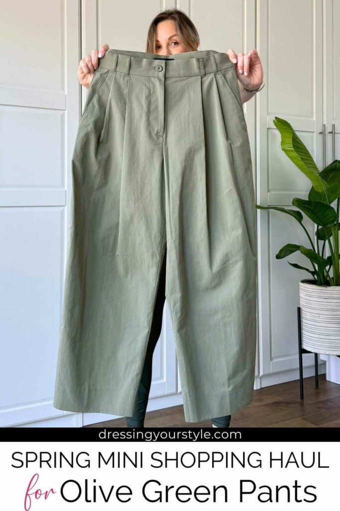 Woman holding a pair of olive green pants in front of her with text below reading spring mini shopping haul for olive green pants. 