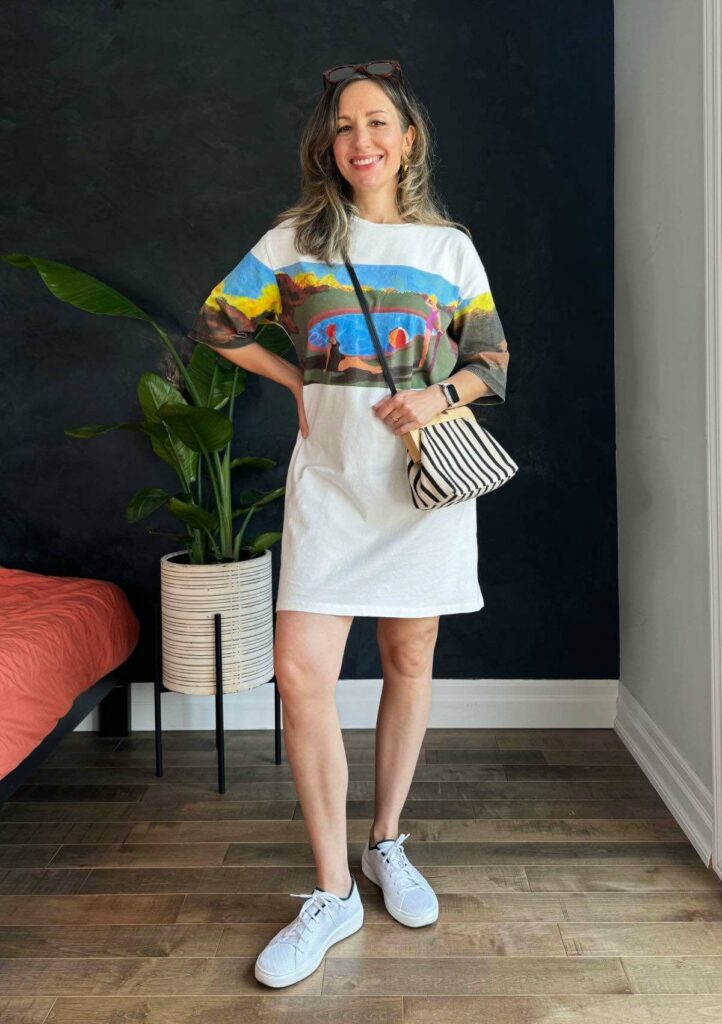 Woman posing wearing a cotton graphic T-shirt dress.